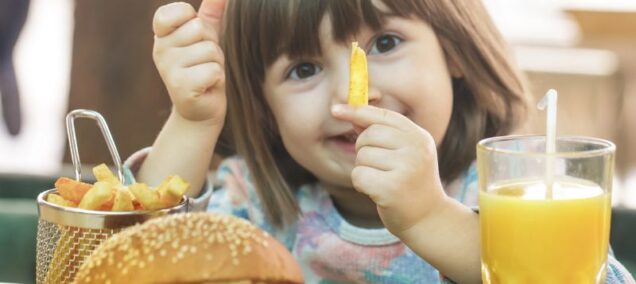 kids eat free lansing little girl with burger and fries