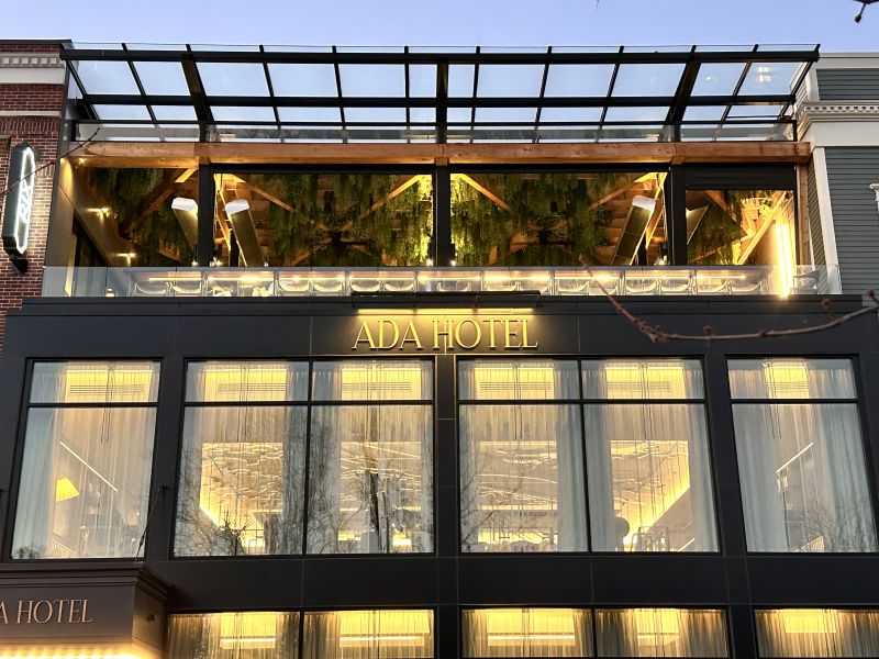 Ada Hotel exterior with lights on