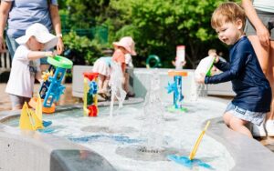 Meijer-Gardens-ArtPrize-title-sponsor-2025-kids-playing-in-water-table